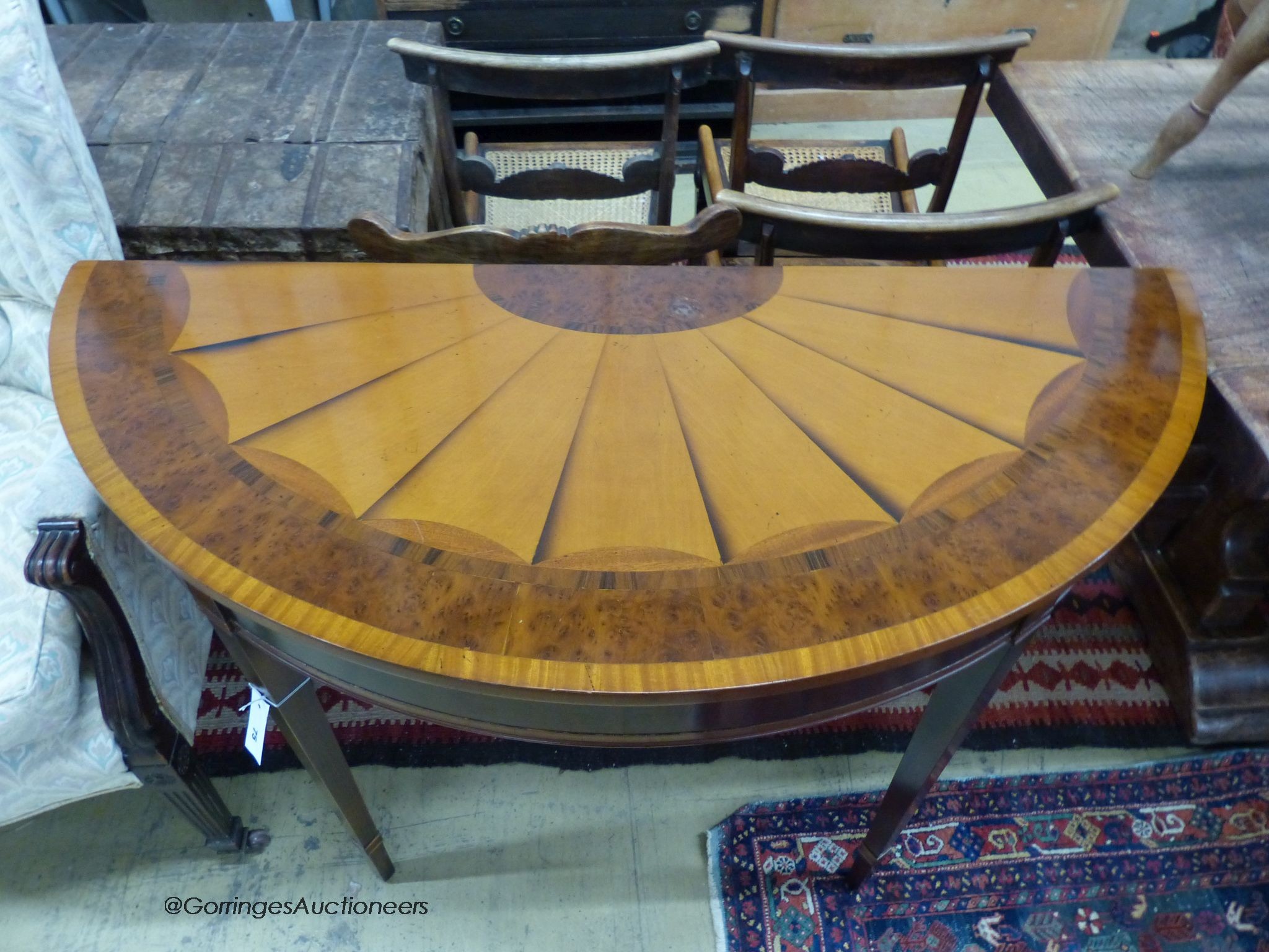 A reproduction Sheraton style inlaid satinwood D shaped consul table, length 114cm, depth 49cm, height 84cm